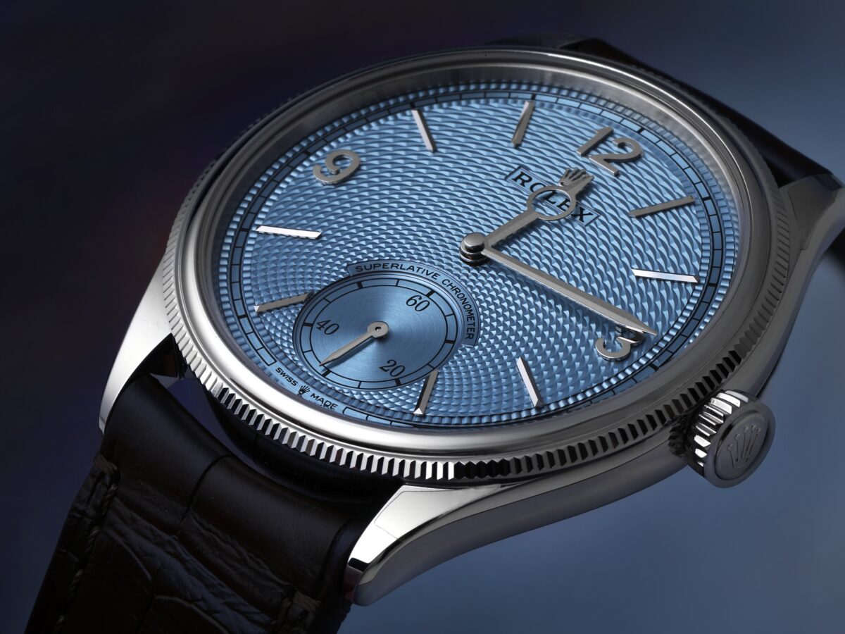 A close-up view of the platinum Rolex 1908 featuring an ice blue guilloché dial and brown leather strap, representing the elegant dress watch worn by Leonardo DiCaprio at the 2026 Oscars.