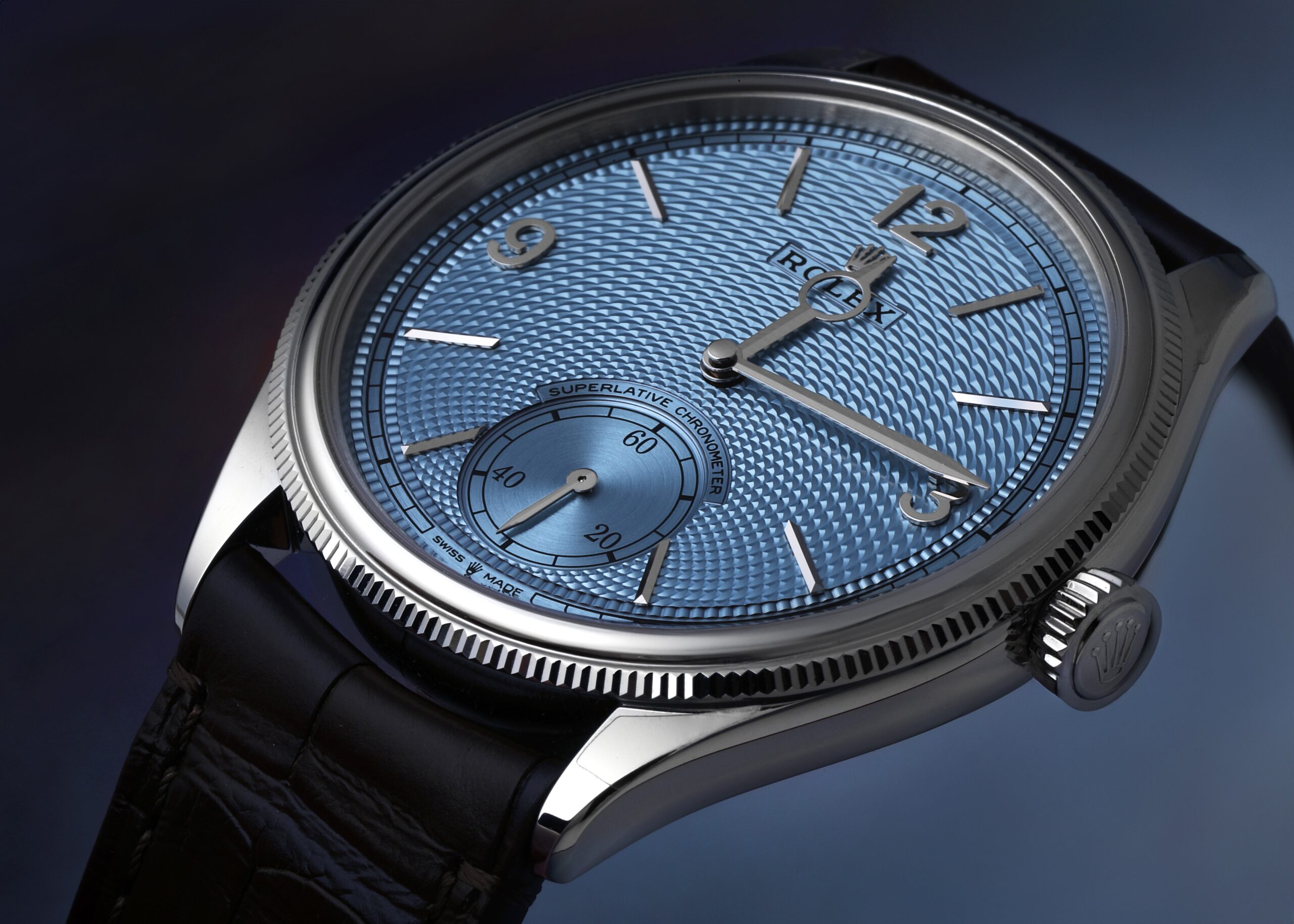 A close-up view of the platinum Rolex 1908 featuring an ice blue guilloché dial and brown leather strap, representing the elegant dress watch worn by Leonardo DiCaprio at the 2026 Oscars.