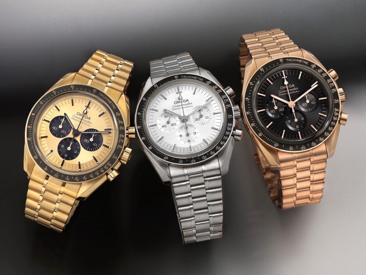 A horizontal comparison view of three Omega Speedmaster Professional watches. The left is made from pale yellow 18K Moonshine Gold, the middle is from silvery 18K Canopus Gold, and the right is from warm rose 18K Sedna Gold, all with distinct bracelets and dials.