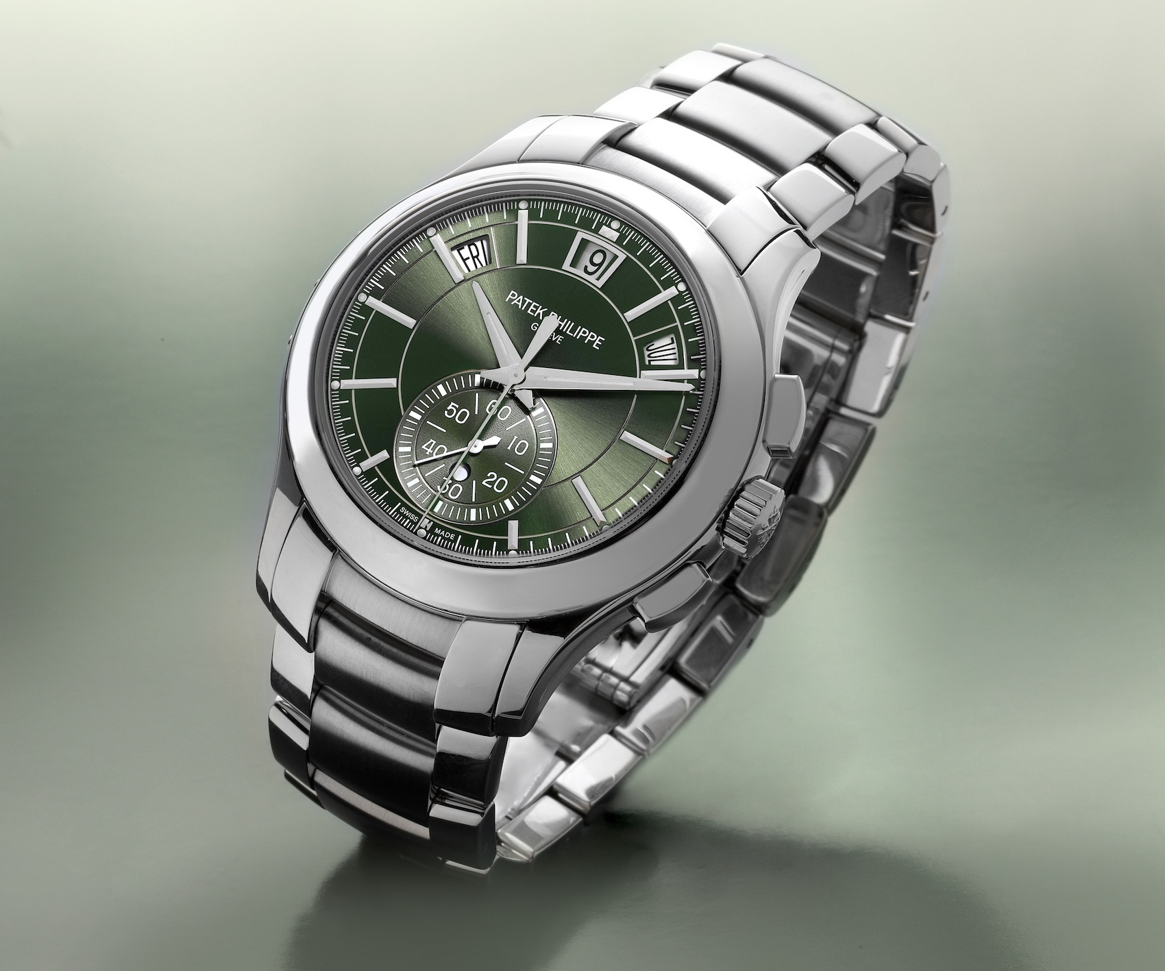 Patek Philippe Complications Annual Calendar Ref 5905/1A in stainless steel featuring an olive green sunburst dial and steel bracelet.