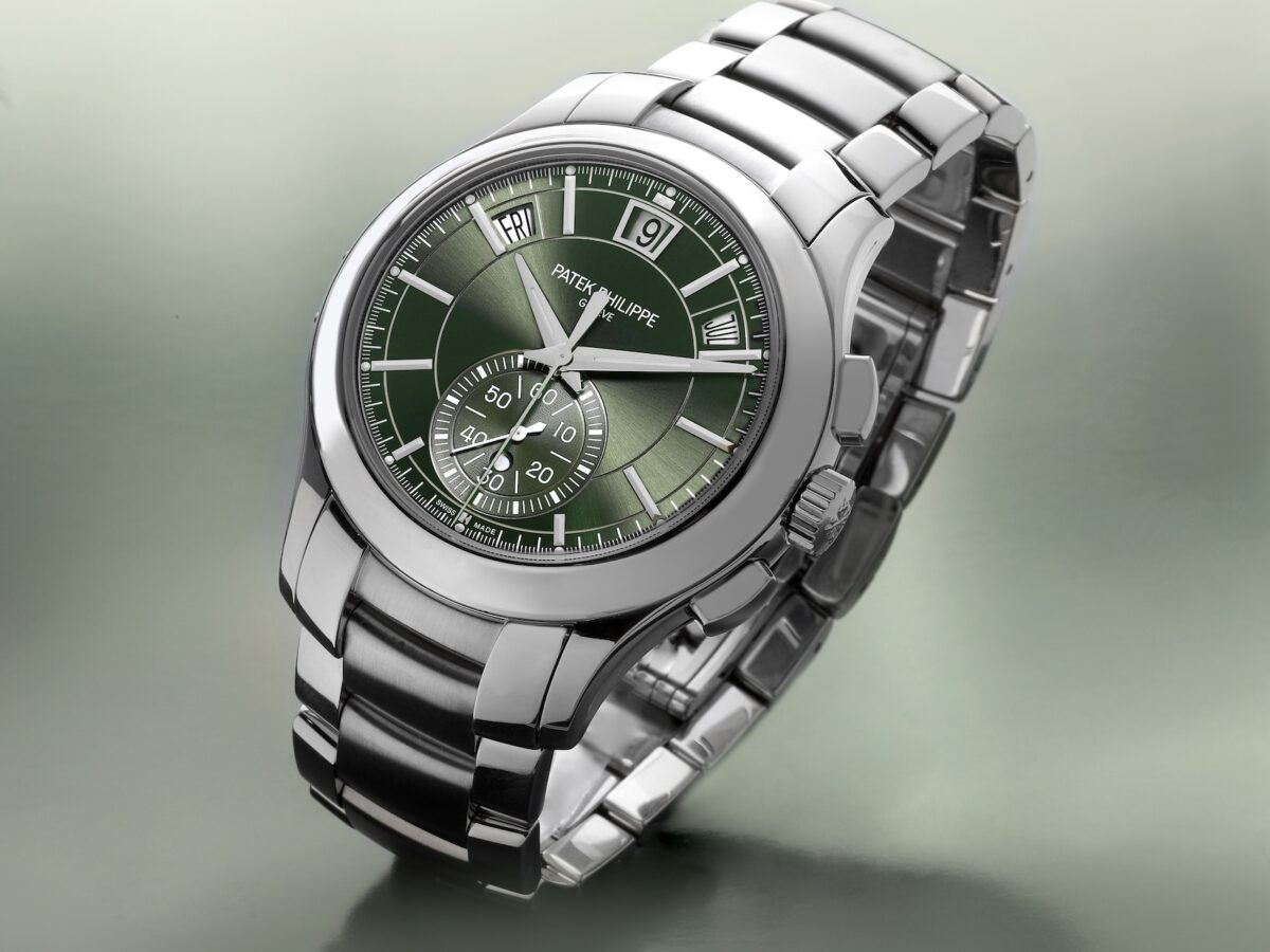 Patek Philippe Complications Annual Calendar Ref 5905/1A in stainless steel featuring an olive green sunburst dial and steel bracelet.