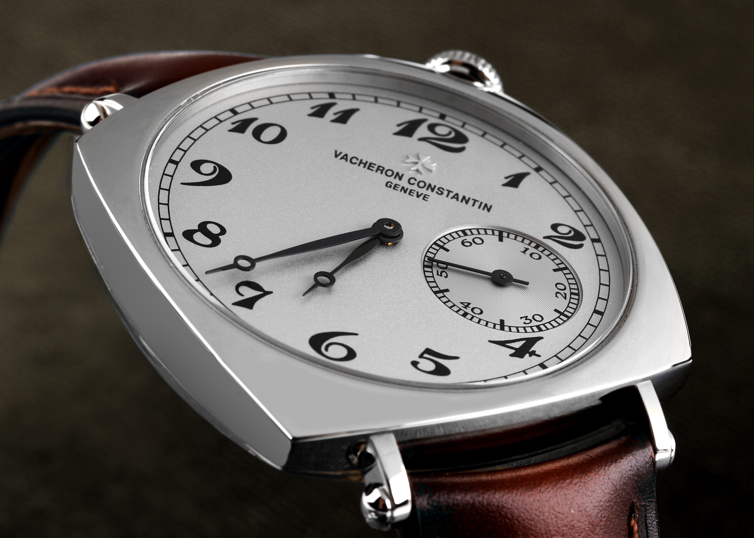 A close-up view of the Vacheron Constantin Historiques American 1921 featuring a silver dial with tilted black Arabic numerals and a brown leather strap, worn by Paul Anthony Kelly at the 2026 Oscars.