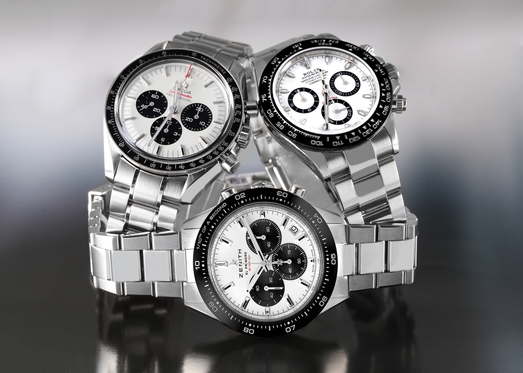 Rolex Daytona white dial compared to Zenith Chronomaster Sport and Omega Speedmaster chronographs.