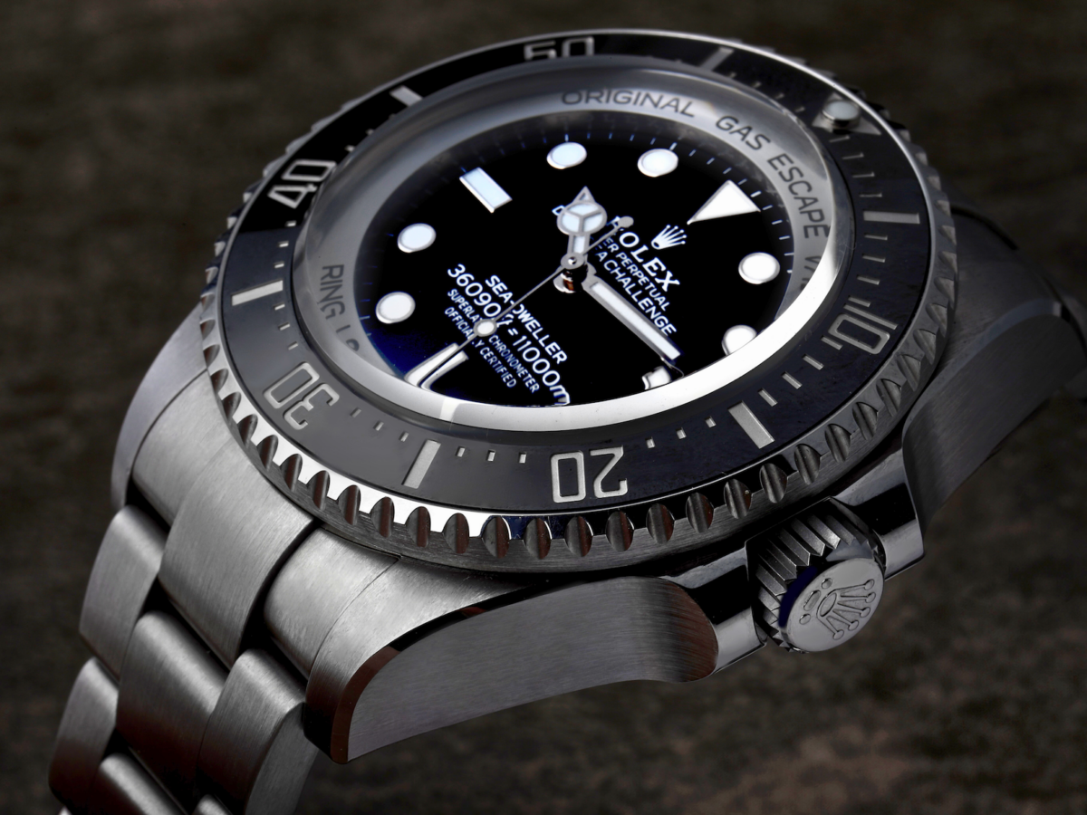 Close-up of the matte black dial, Cerachrom bezel, and Triplock crown on the RLX Titanium Rolex Deepsea Challenge 126067.
