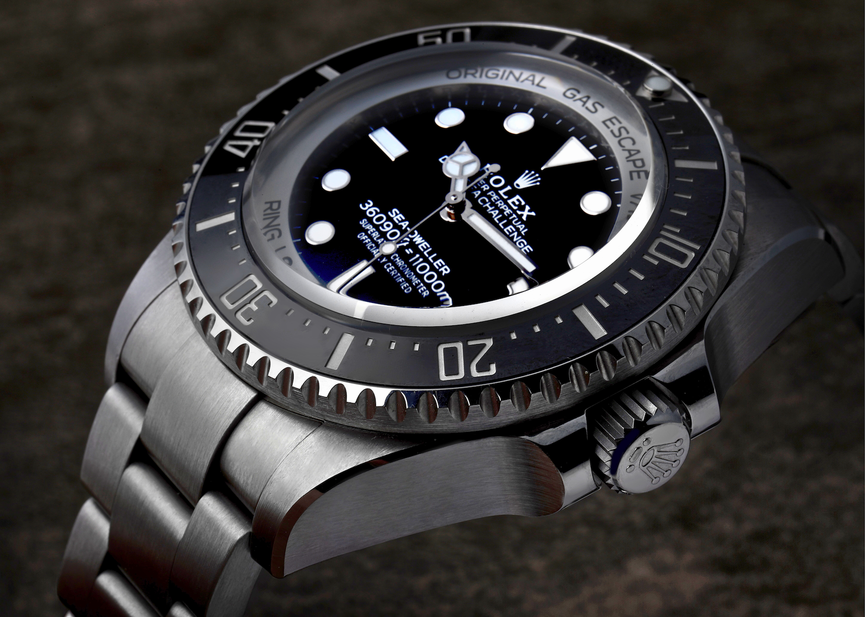 Close-up of the matte black dial, Cerachrom bezel, and Triplock crown on the RLX Titanium Rolex Deepsea Challenge 126067.