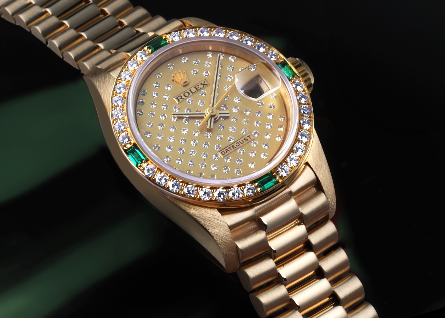 Rolex President Datejust Ref 69078 in 18k yellow gold with Pleiades diamond dial and diamond emerald bezel.