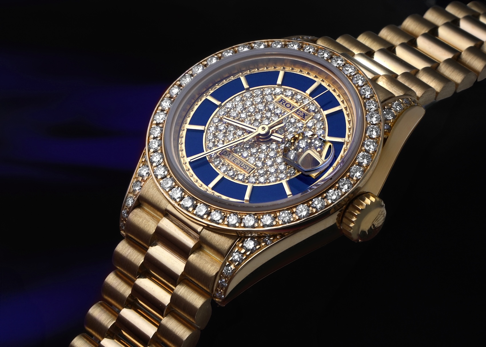 Rolex President Datejust Ref 69158 in 18k yellow gold featuring a blue lapis lazuli dial with pave diamond center and diamond bezel.