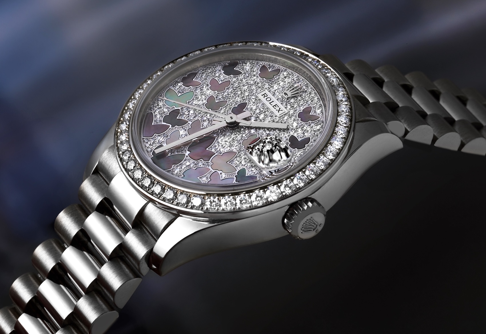 Rolex President Midsize 31mm Ref 278289 in 18k white gold with pave diamond dial and mother of pearl butterfly motifs.