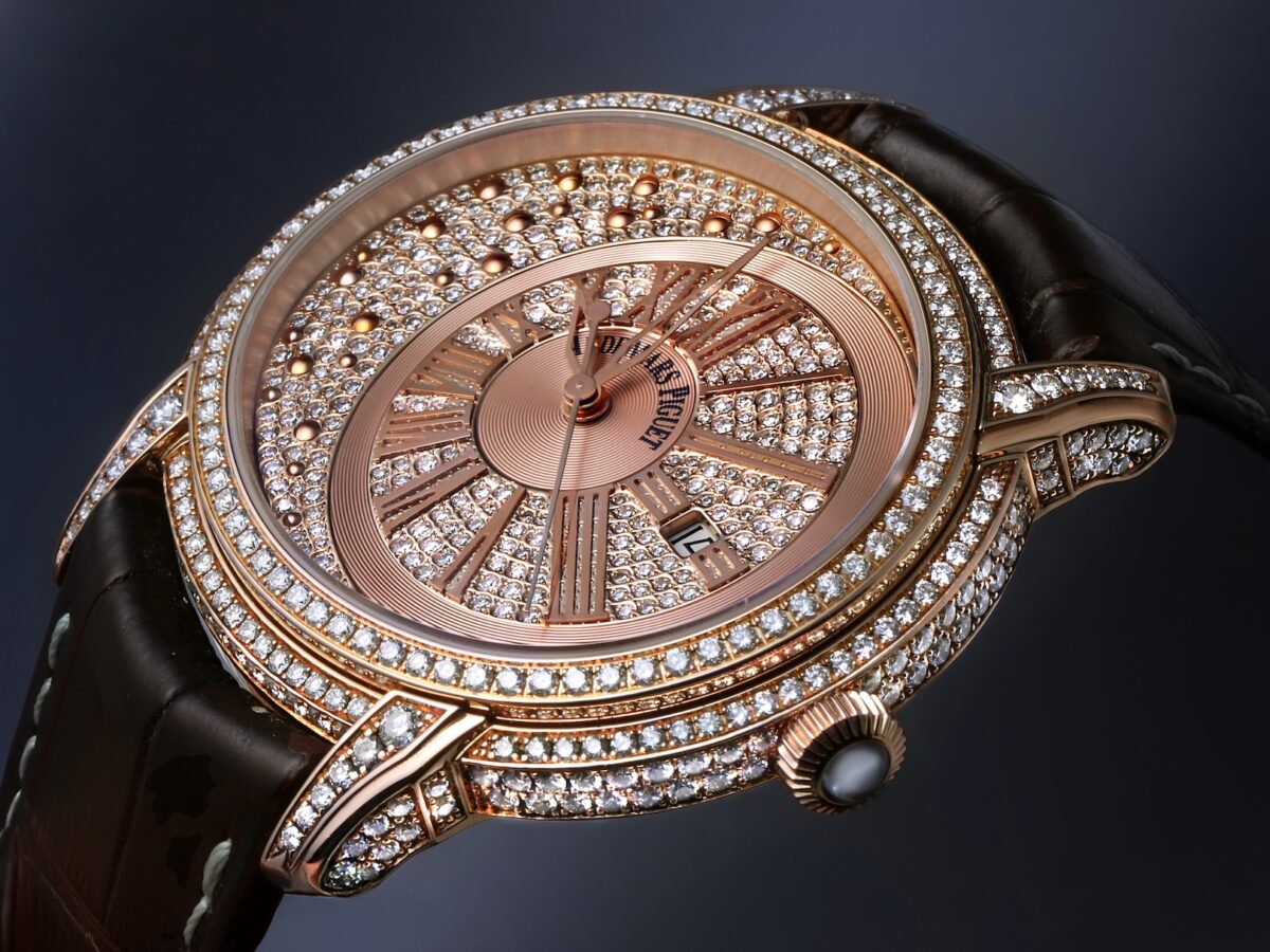 Angled view of Audemars Piguet Millenary Morita in rose gold with an off-center diamond-paved dial and brown leather strap.