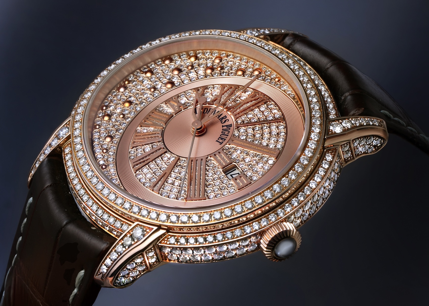 Angled view of Audemars Piguet Millenary Morita in rose gold with an off-center diamond-paved dial and brown leather strap.