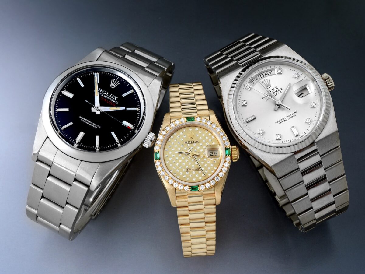 Cover graphic showcasing two highly underrated vintage Rolex watches: a black dial stainless steel Milgauss Ref. 1019 and a white gold Oysterquartz Day-Date Ref. 19019 on an integrated bracelet.