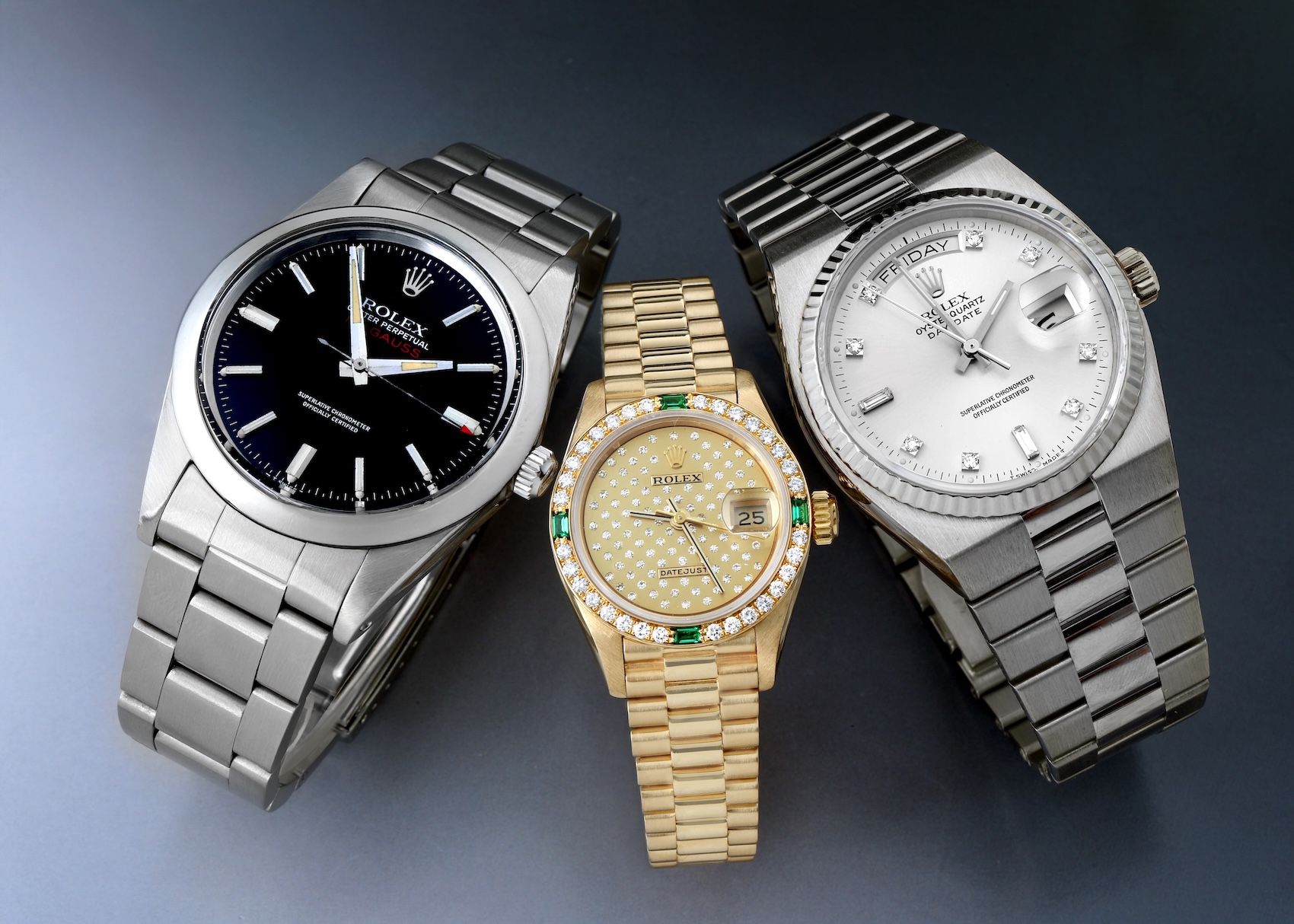 Cover graphic showcasing two highly underrated vintage Rolex watches: a black dial stainless steel Milgauss Ref. 1019 and a white gold Oysterquartz Day-Date Ref. 19019 on an integrated bracelet.