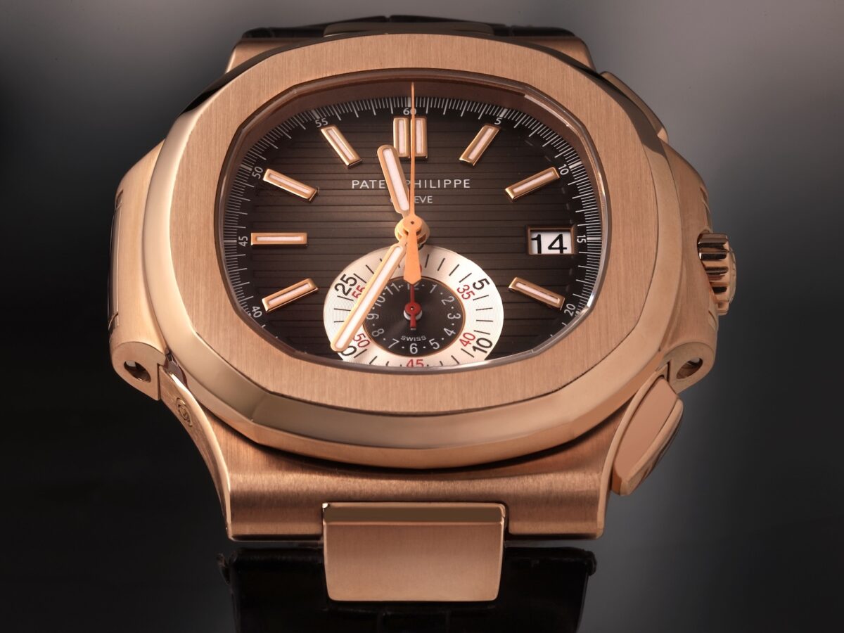 Close-up of the Patek Philippe Nautilus Chronograph Ref 5980R-001 in 18k rose gold, featuring the signature black-brown gradient dial and 6 o'clock monocounter.
