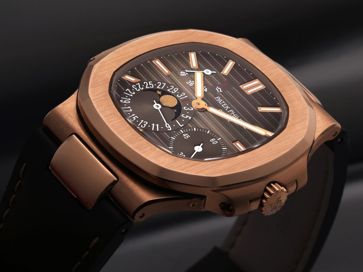 Close-up of the Patek Philippe Nautilus 5712R moonphase dial with power reserve indicator in 18k rose gold.