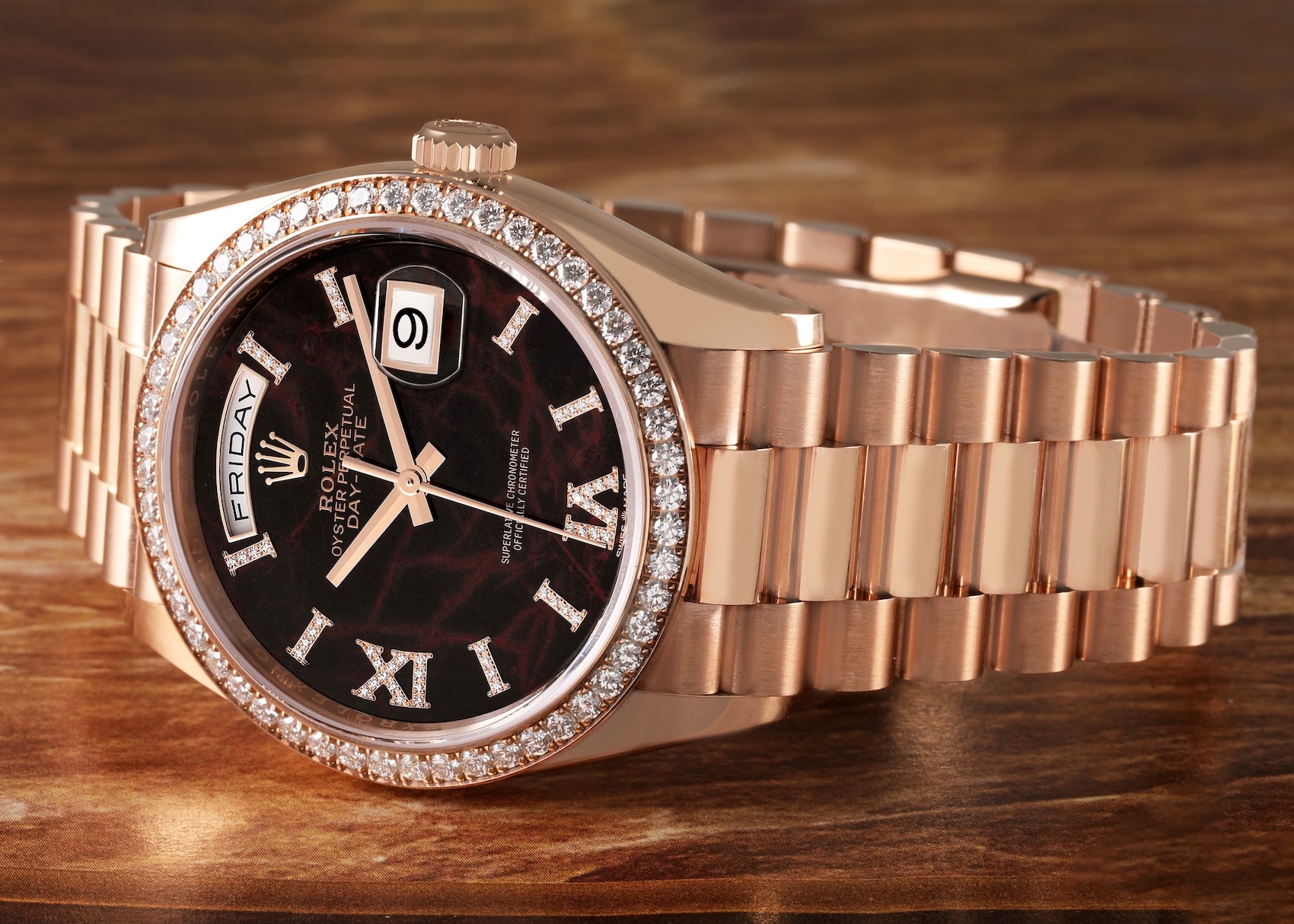 Rolex Day-Date 36 in Everose gold featuring a rare Eisenkiesel stone dial, diamond hour markers, and diamond bezel.