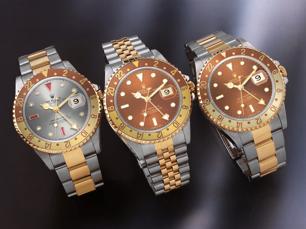 Three Rolex GMT-Master II 16713 Root Beer watches on a dark background showing Serti dial, Jubilee, and Oyster bracelet variations.