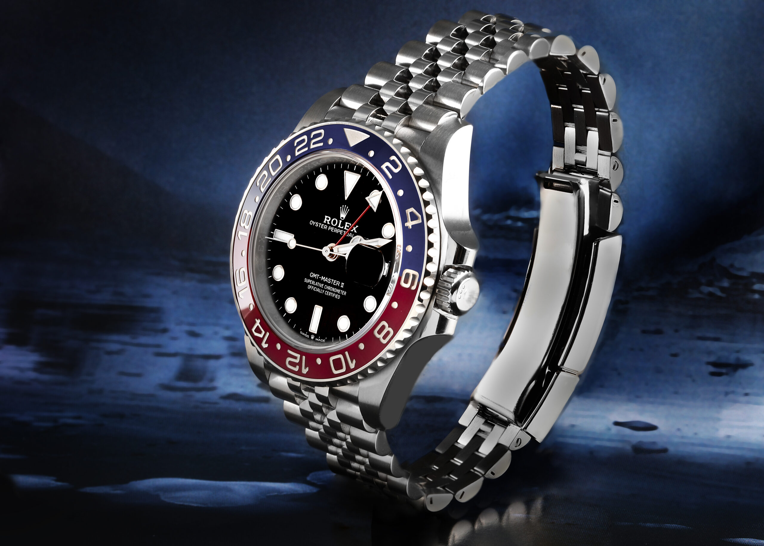 Side profile view of the discontinued stainless steel Rolex GMT-Master II Pepsi reference 126710BLRO showcasing the Jubilee bracelet and red and blue Cerachrom bezel.