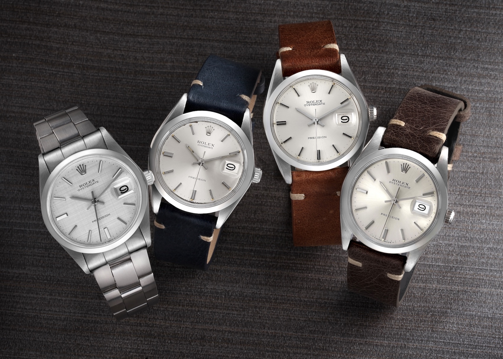 A collection of vintage Rolex Oysterdate Precision Reference 6694 watches displayed on stainless steel bracelets and leather straps.
