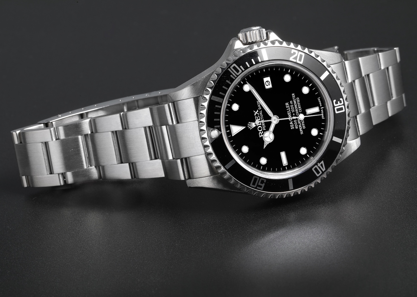 Neo-vintage Rolex Sea-Dweller Reference 16600 stainless steel dive watch featuring a black dial without a cyclops date magnifier.