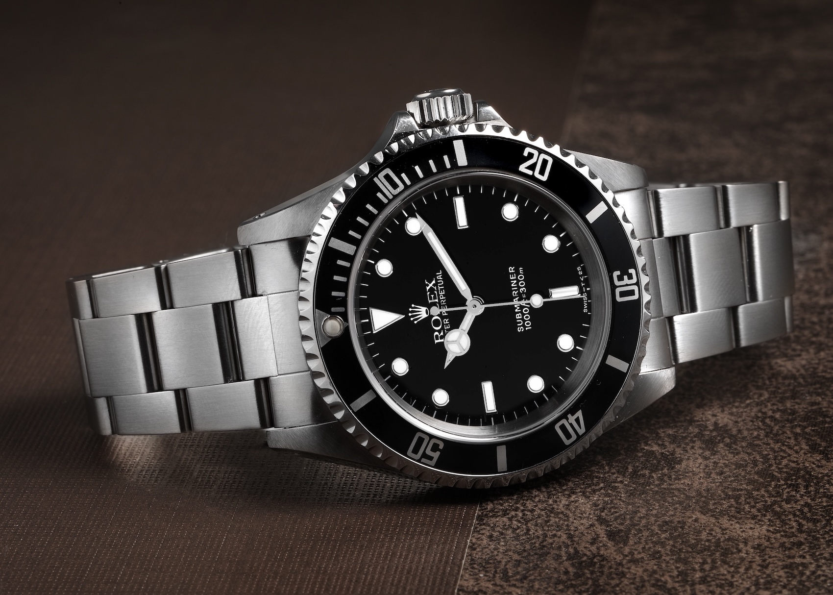 Rolex Submariner Reference 14060 displaying its perfectly symmetrical clean two-liner black dial without a date window.