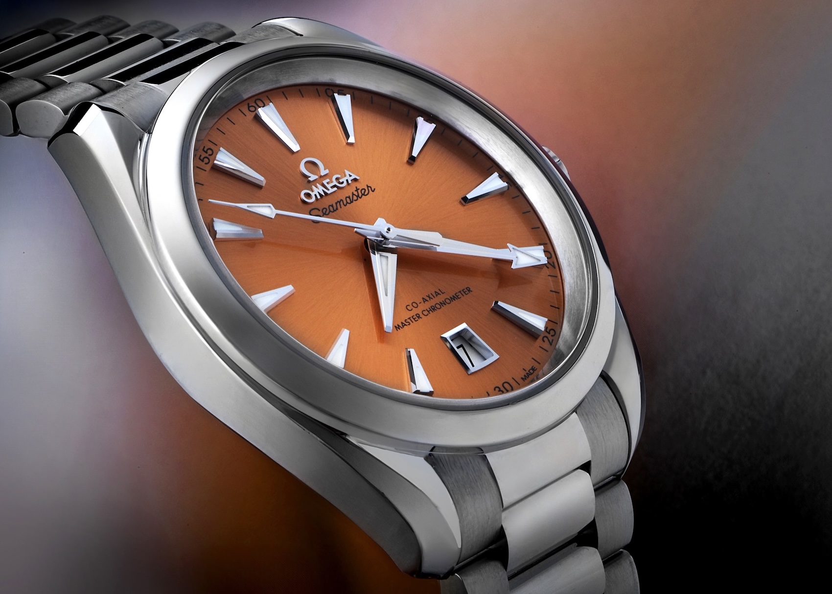 Omega Seamaster Aqua Terra from the Shades collection featuring a vibrant saffron orange dial.
