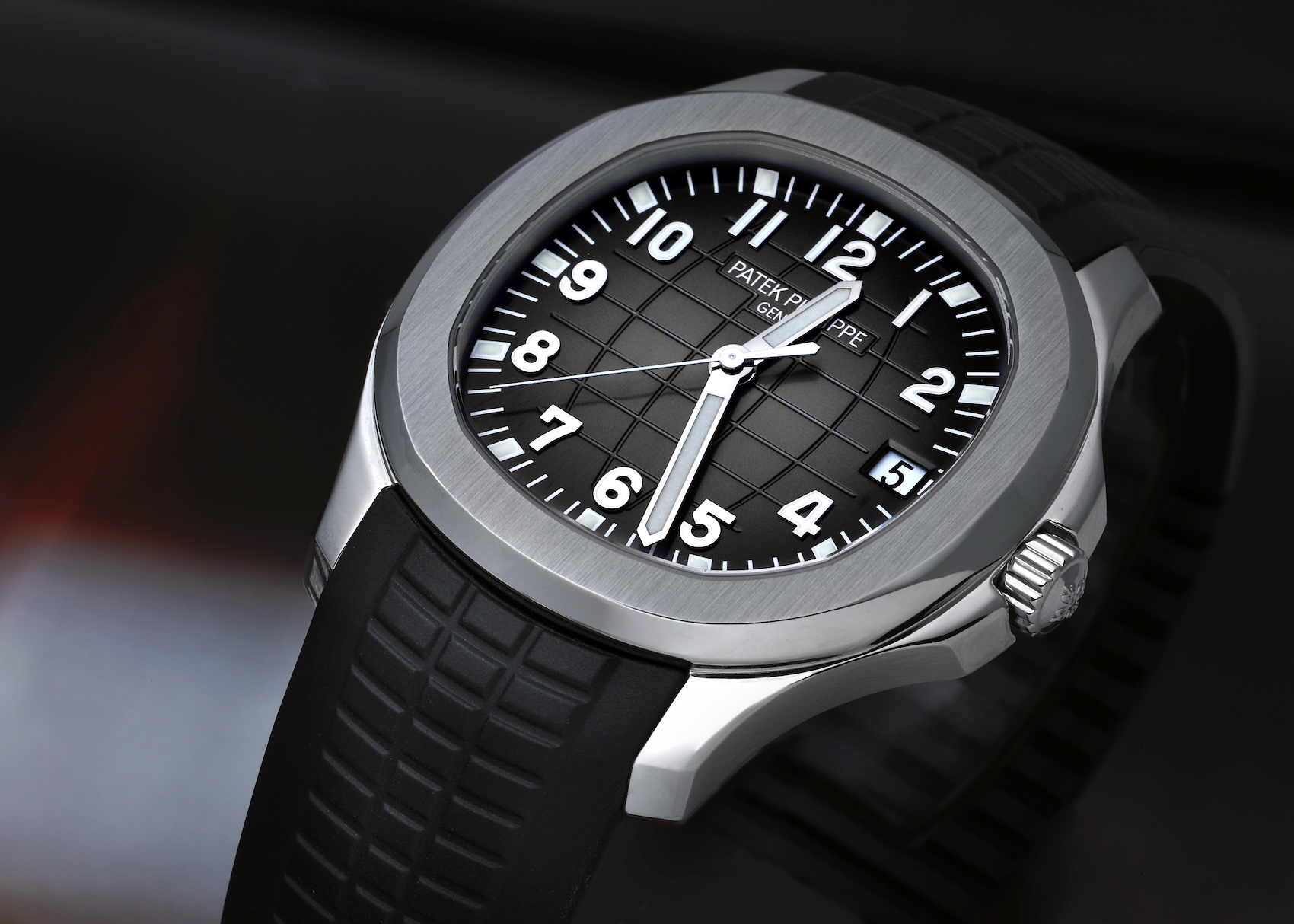 Stainless steel Patek Philippe Aquanaut reference 5167A with a black embossed dial on a matching black composite tropical rubber strap.