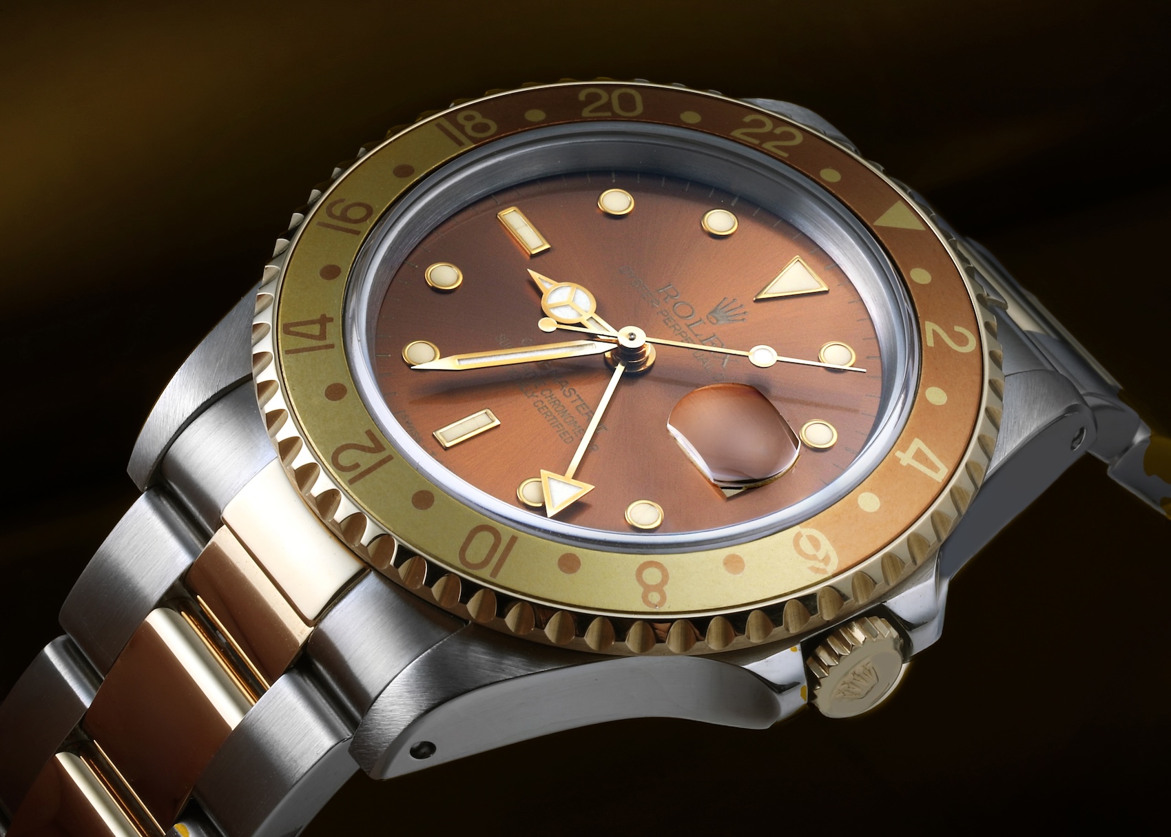 Vintage Rolex GMT-Master II Root Beer reference 16713 in two-tone stainless steel and yellow gold with a brown sunburst dial.