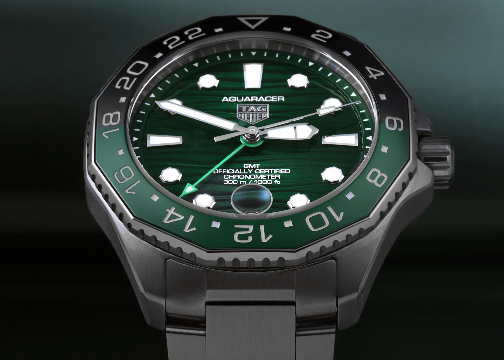 TAG Heuer Aquaracer Professional 300 Date watch displaying a vibrant green ribbed dial, luminescent markers, and a green ceramic bezel.