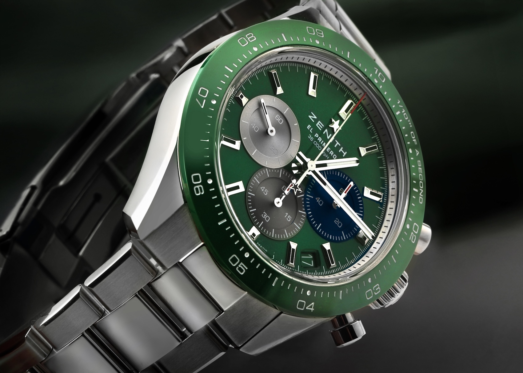 Close-up of the Zenith Chronomaster Sport watch featuring a sunray green dial, matching green ceramic 1/10th of a second bezel, and tricolor subdials.