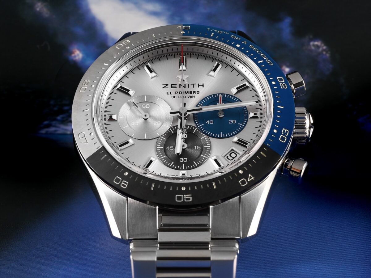 Front-facing view of the Zenith Chronomaster Sport displaying its high-contrast white dial, distinct blue, anthracite, and light grey subdials, and blue ceramic bezel.