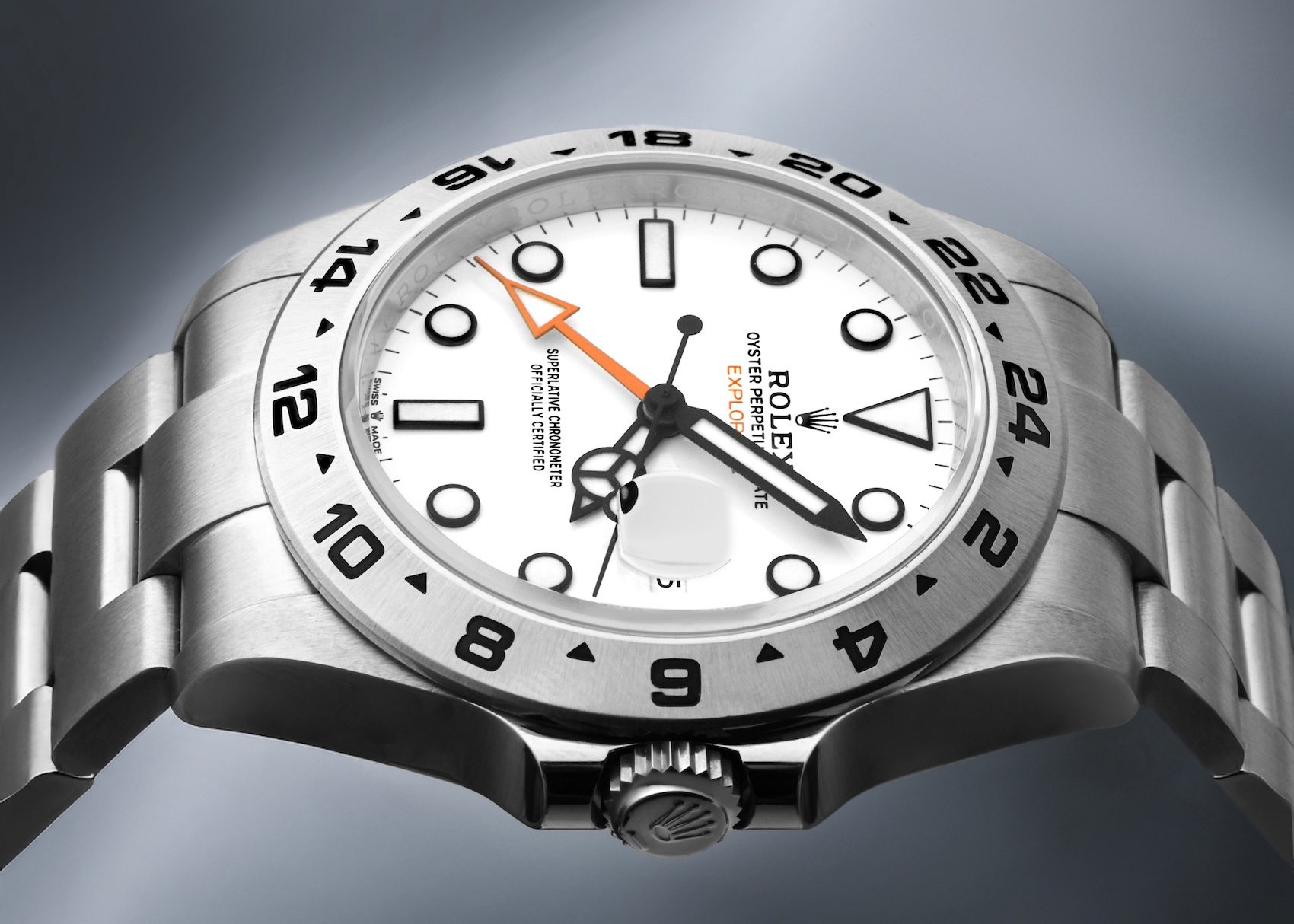 Close up of the modern 42mm Rolex Explorer II 226570 with polar white dial and oversized orange Maxi hand.