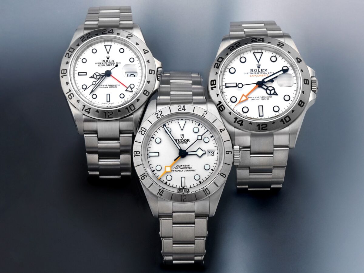 Group shot comparing the Rolex Explorer II 16570, Tudor Black Bay Pro Opaline, and Rolex Explorer II 226570 white dial GMT watches.