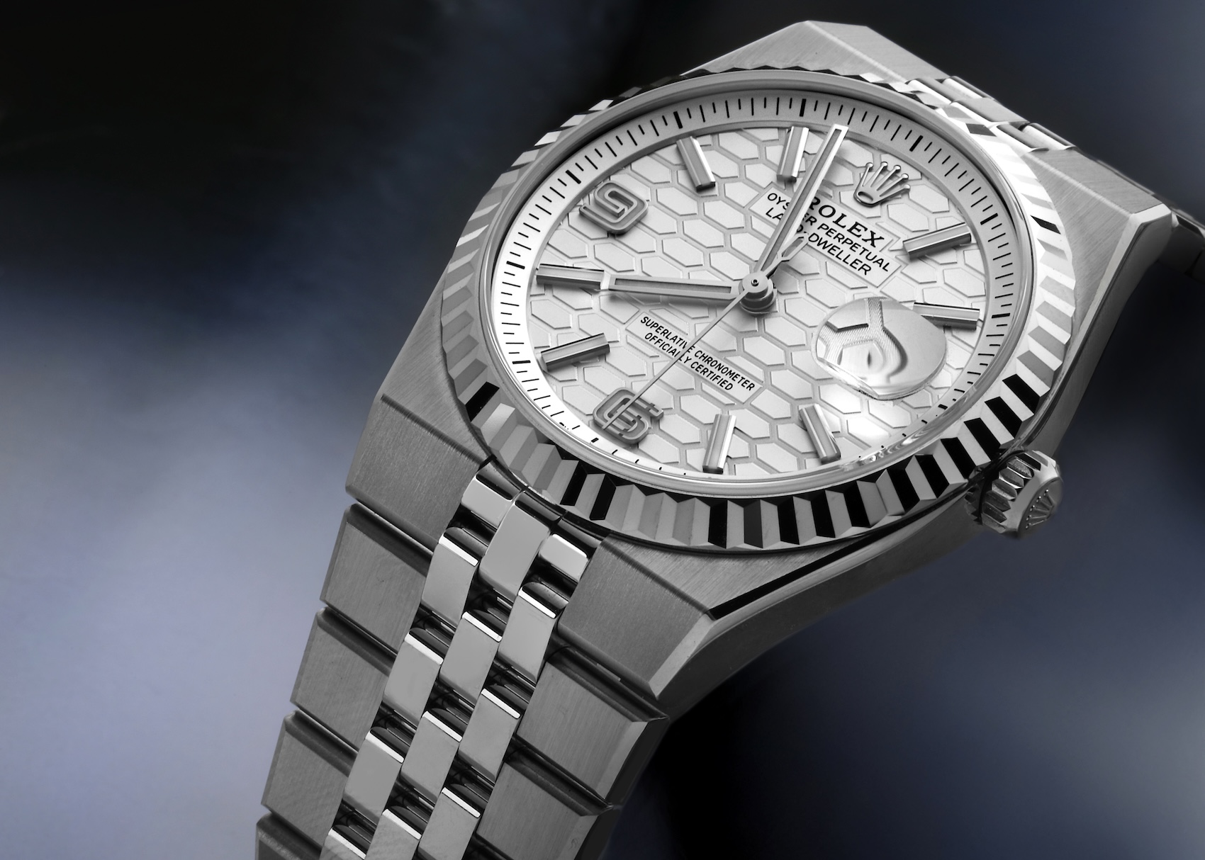  Close-up of the Rolex Land-Dweller 40mm featuring an 18k white gold fluted bezel and honeycomb motif dial.