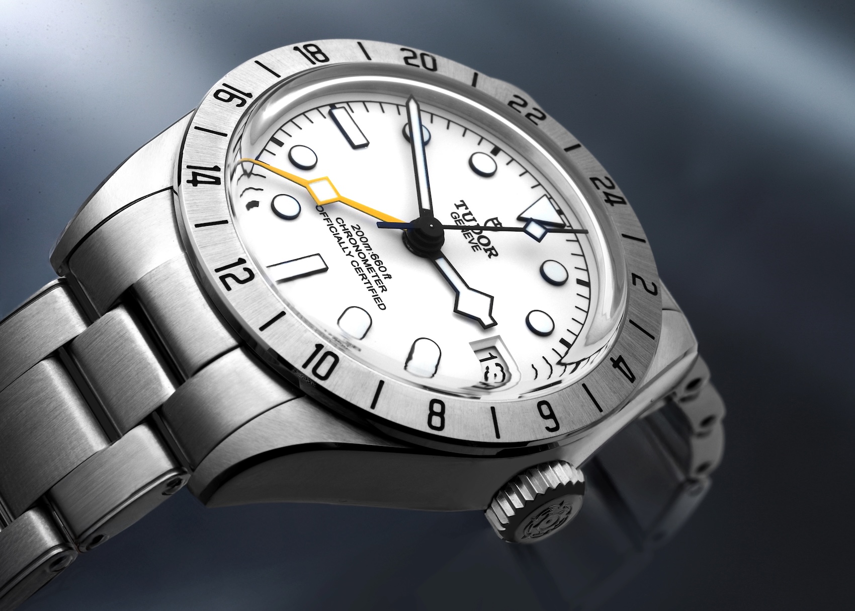 Close up of the Tudor Black Bay Pro 79470 featuring the opaline white dial and yellow snowflake GMT hand.
