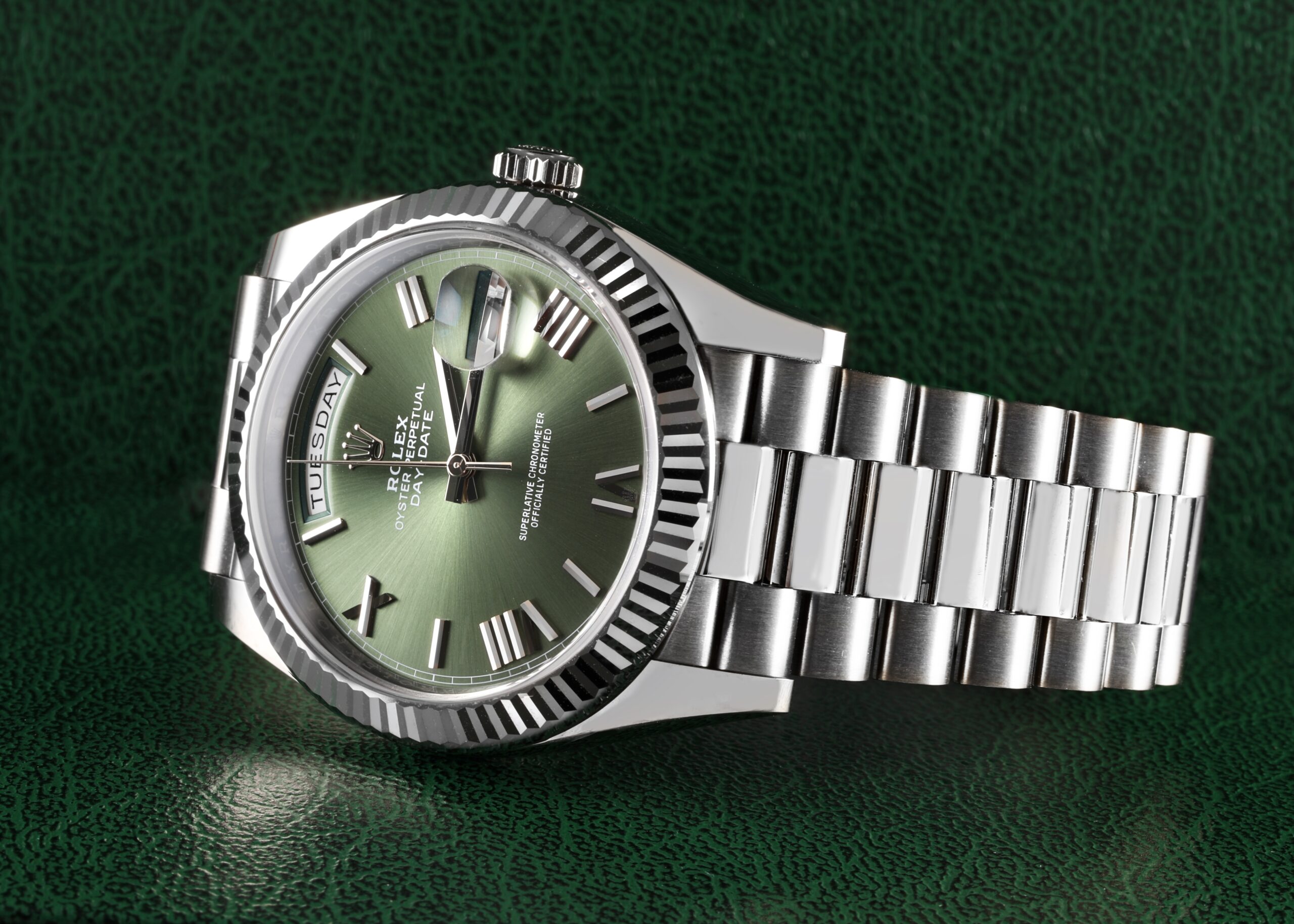Close-up of the 18k white gold Rolex Day-Date 40 with an olive green dial, fluted bezel, and President bracelet, a key piece in Vinícius Júnior's luxury watch collection.