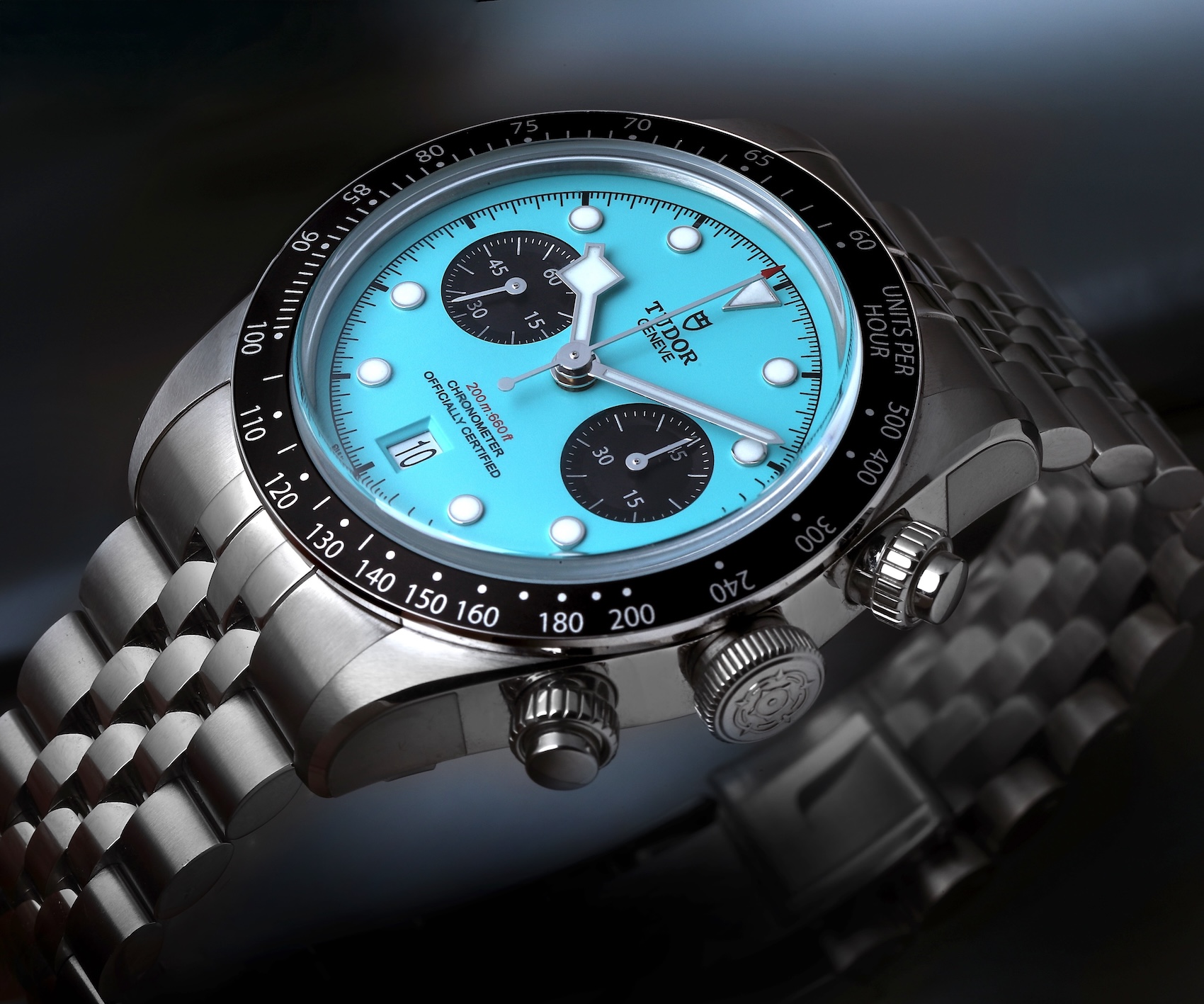 Tudor Black Bay Chronograph watch featuring a turquoise Flamingo dial with black sub-dials on a stainless steel bracelet.