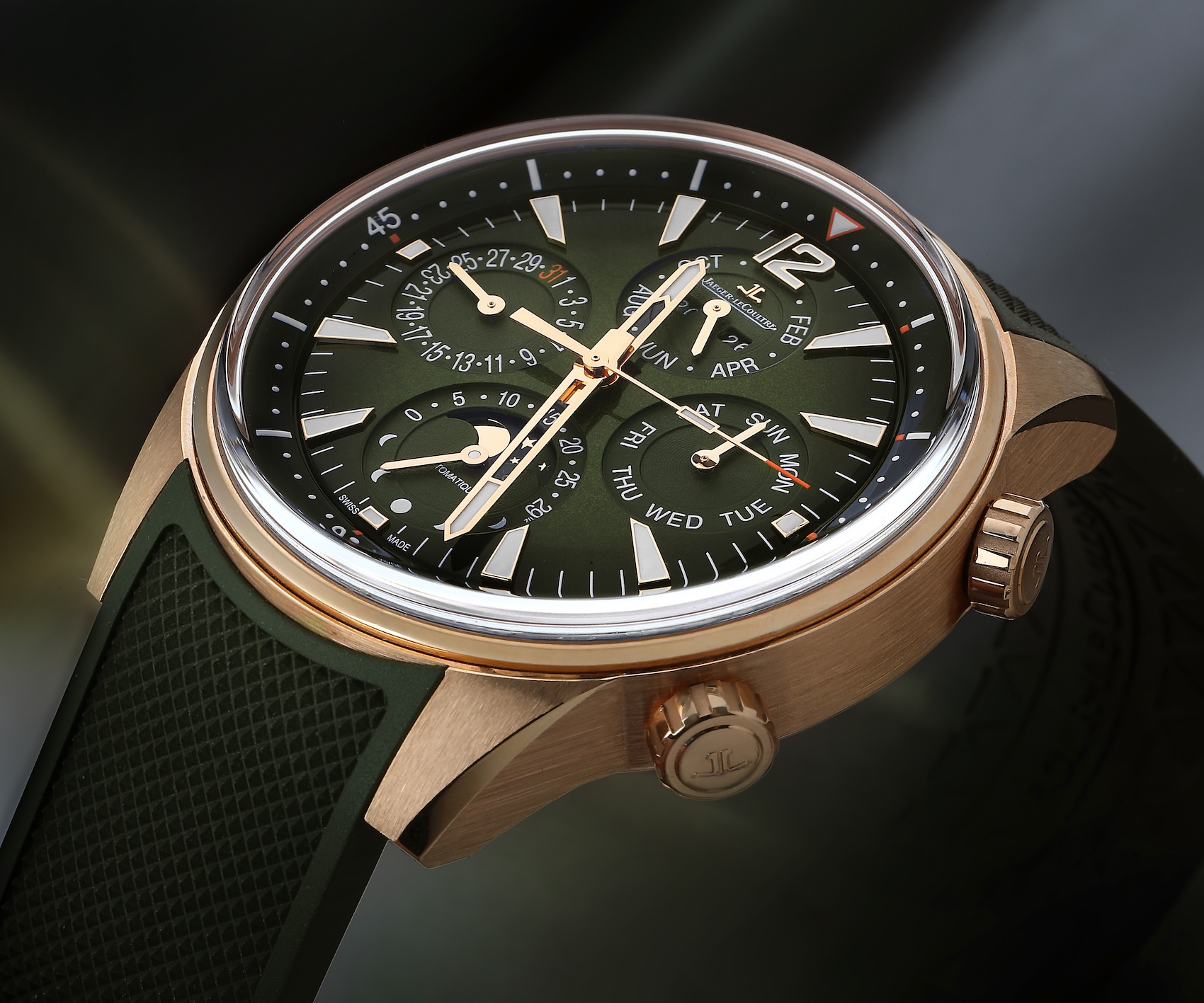 Jaeger-LeCoultre Polaris Perpetual Calendar watch in 18k rose gold featuring a gradient green dial and matching green rubber strap.