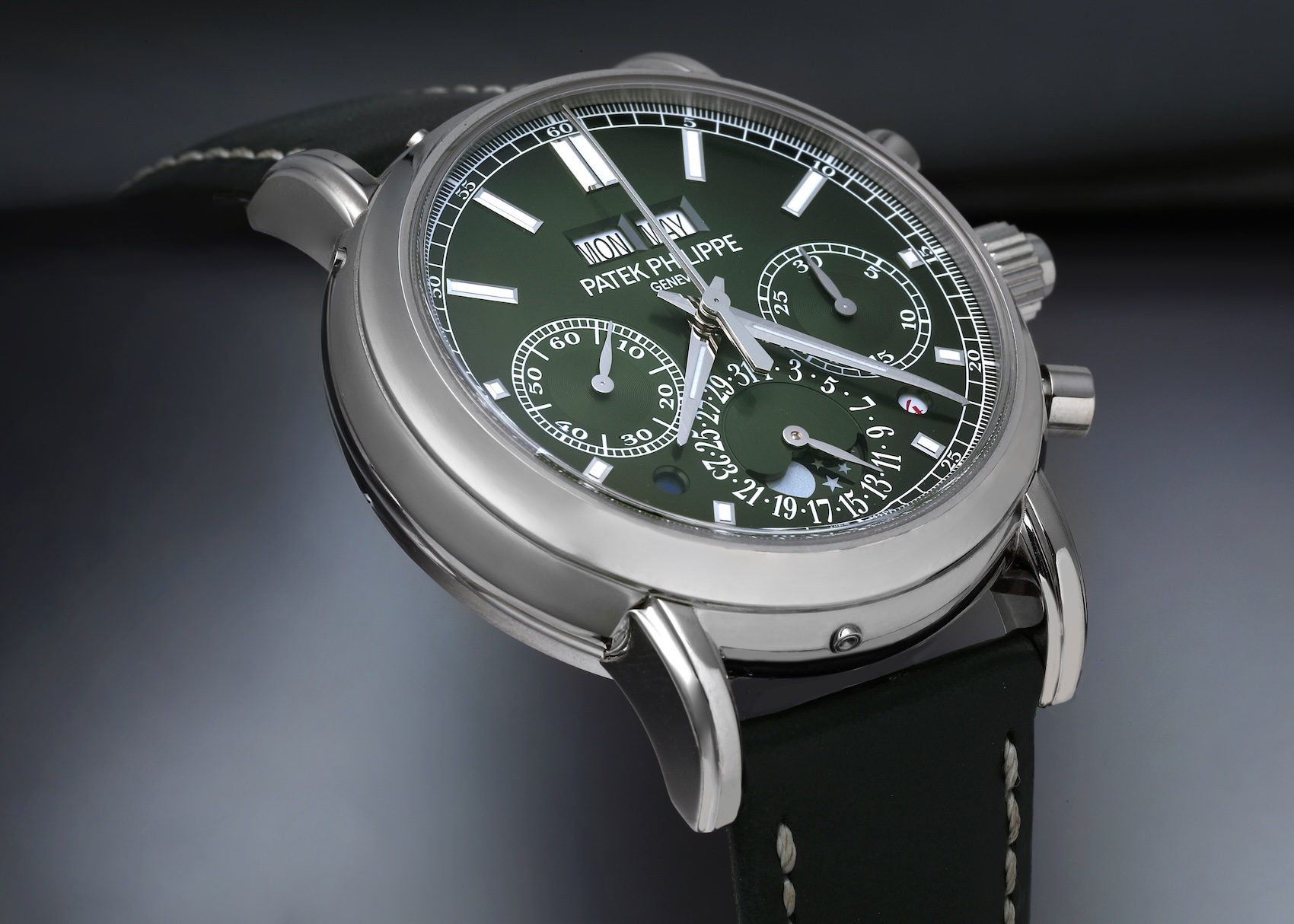 Patek Philippe Grand Complications 5204G in white gold featuring an olive green sunburst dial and leather strap.