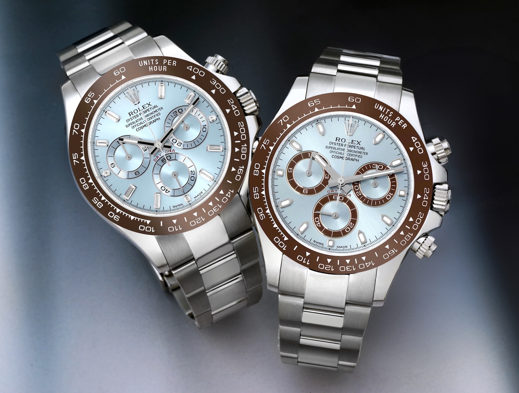 Pair of Rolex Cosmograph Daytona platinum watches with ice blue dials and chestnut brown Cerachrom bezels.