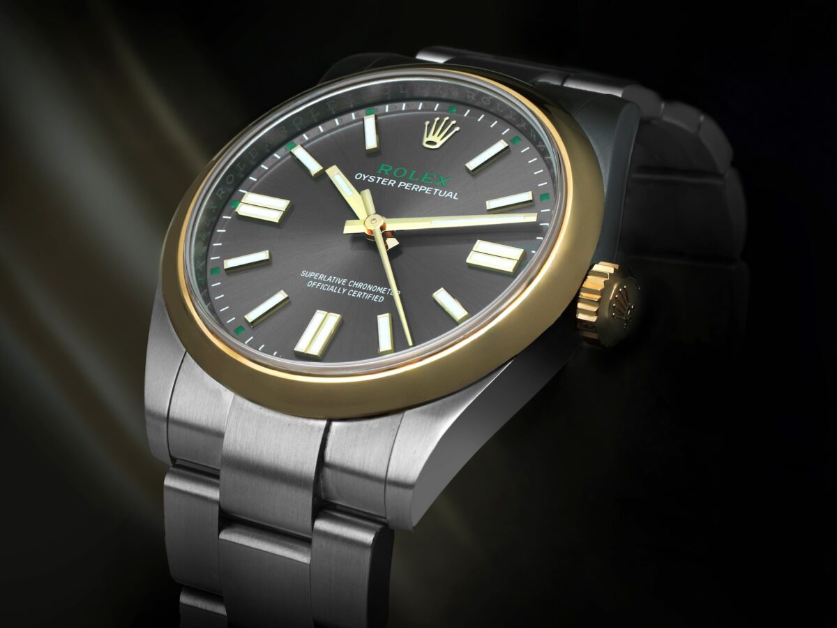 Rolex Oyster Perpetual 41 reference 134303 two-tone watch with slate dial on dark background.