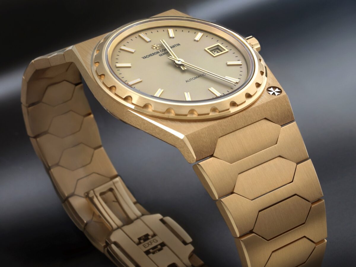 Angled view of the 18K yellow gold Vacheron Constantin Historiques 222 watch showing the dial, fluted bezel, and integrated bracelet.