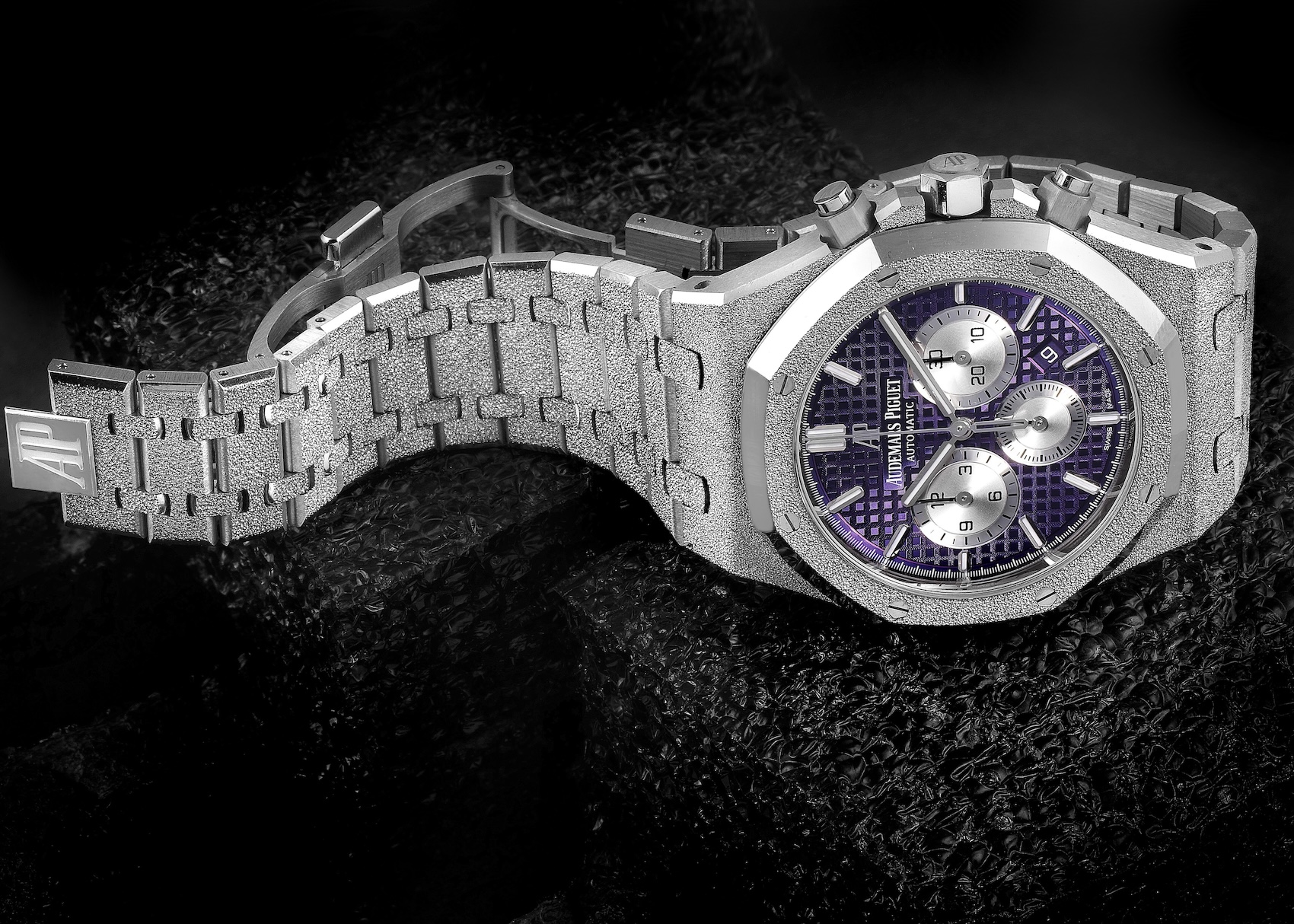 Audemars Piguet Royal Oak Chronograph Frosted Gold reference 26331BC in 18k white gold, featuring a vibrant purple Grande Tapisserie dial and silver-toned subdials. 
