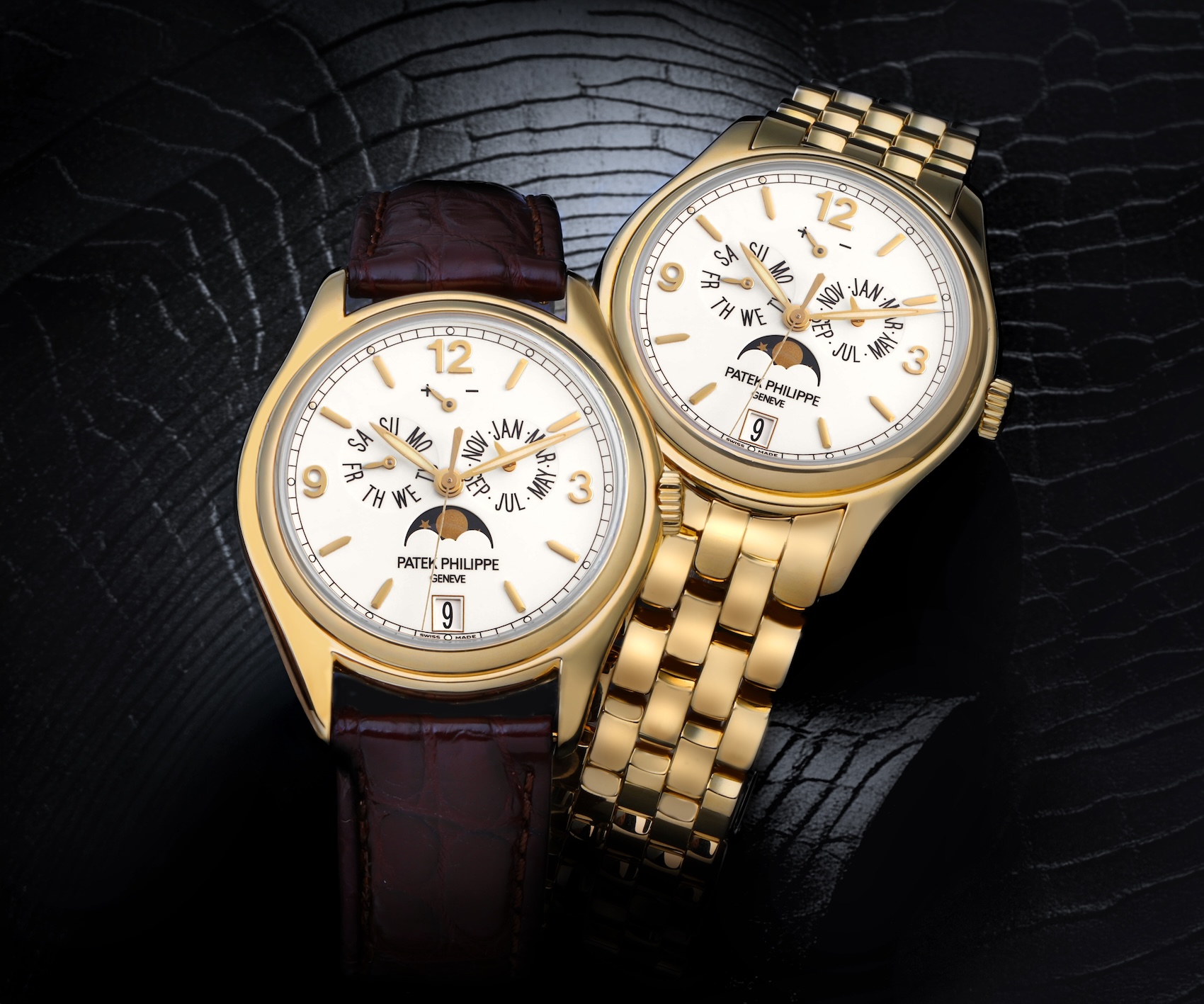 Two Patek Philippe Annual Calendar 5146J watches side-by-side, comparing the brown leather strap with the solid yellow gold multi-link bracelet.