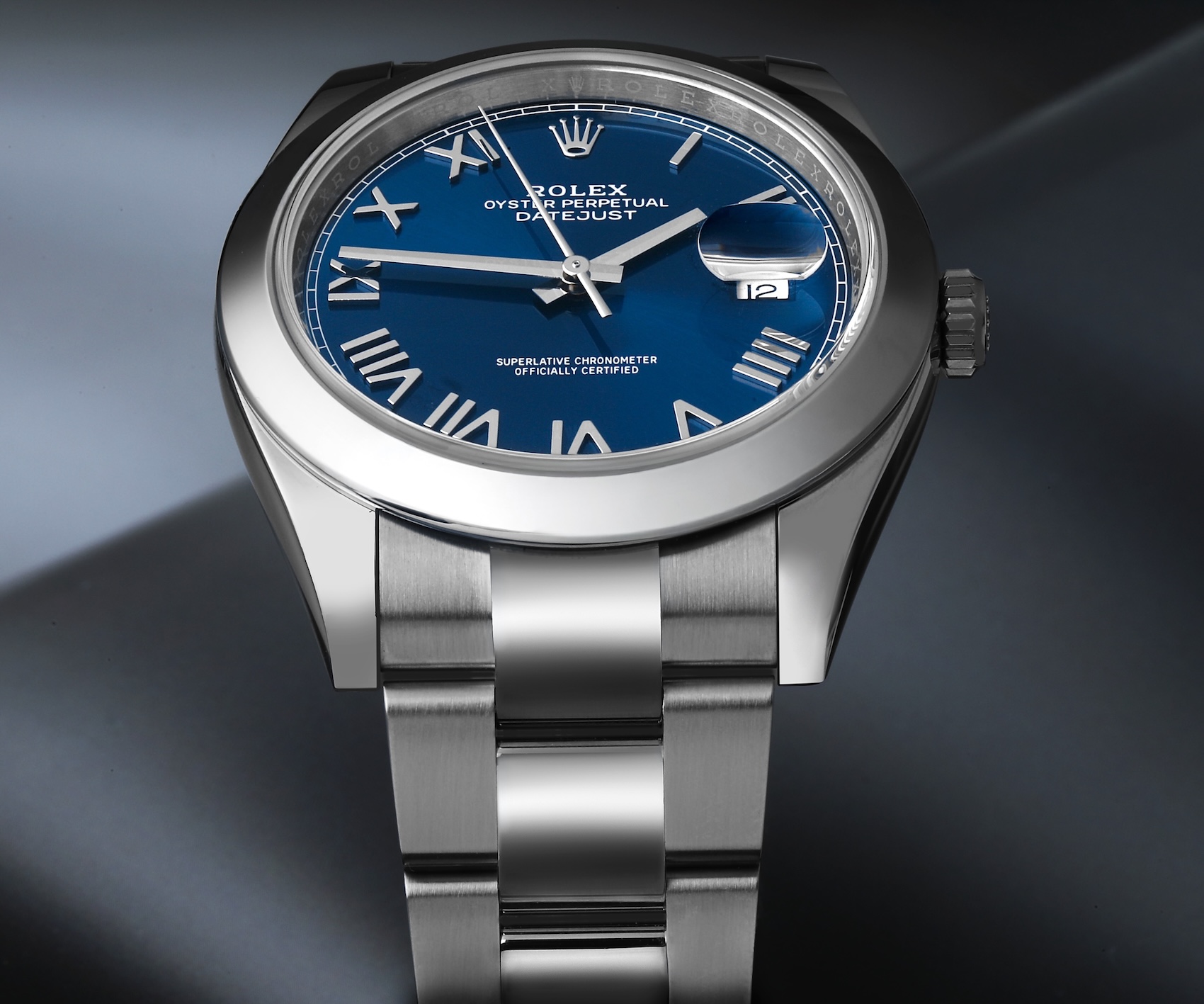 Stainless steel Rolex Datejust 41 reference 126300 with a smooth bezel, Oyster bracelet, and a blue dial featuring deconstructed Roman numerals.