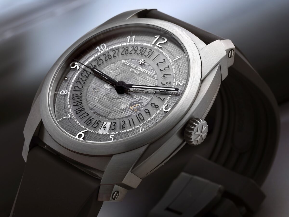 Vacheron Constantin Quai de l'Île Reference 86050 in titanium with a transparent sapphire dial displaying date numerals.
