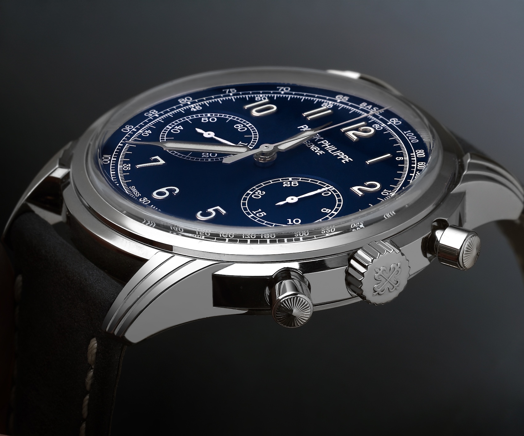 Side profile macro shot of the Patek Philippe 5172G showcasing the 18k white gold case, triple-stepped Art Deco lugs, and vintage-inspired knurled round chronograph pushers.