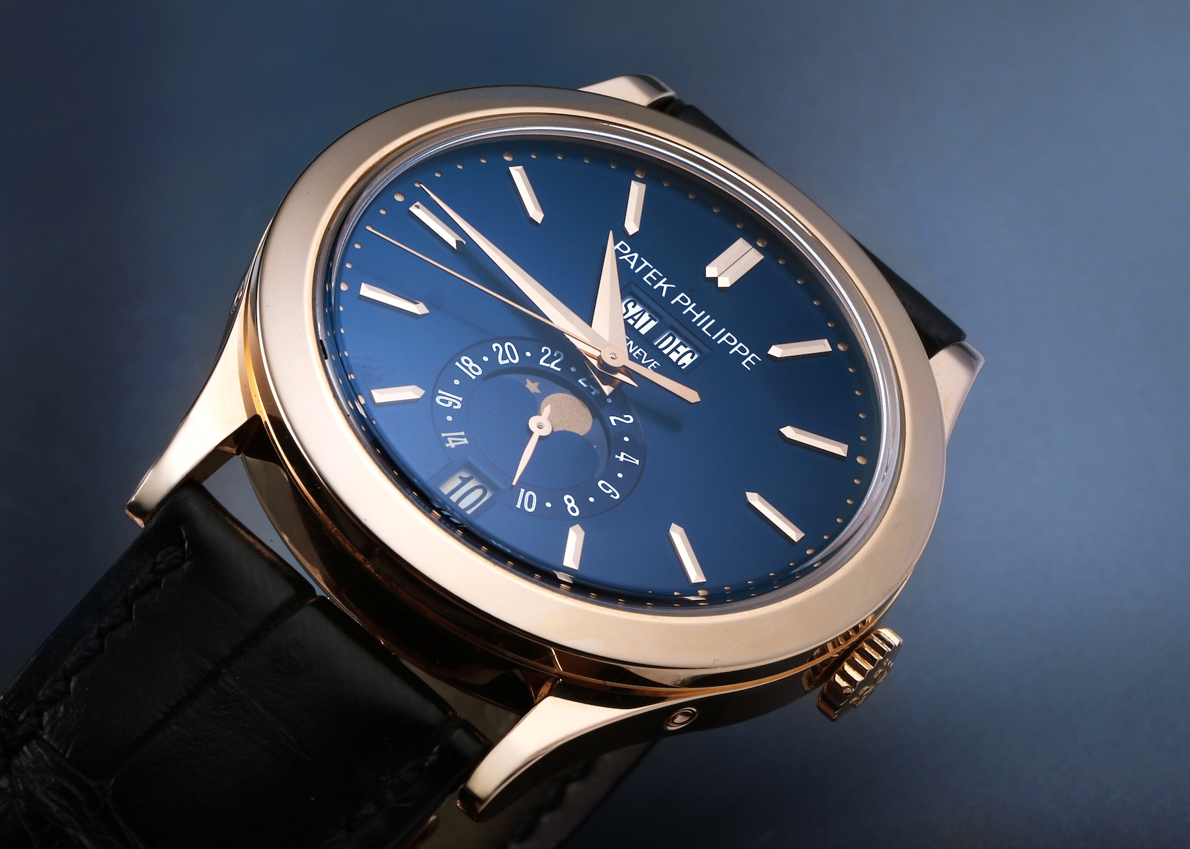 Patek Philippe Annual Calendar Reference 5396R in 18k rose gold with a blue sunburst dial.