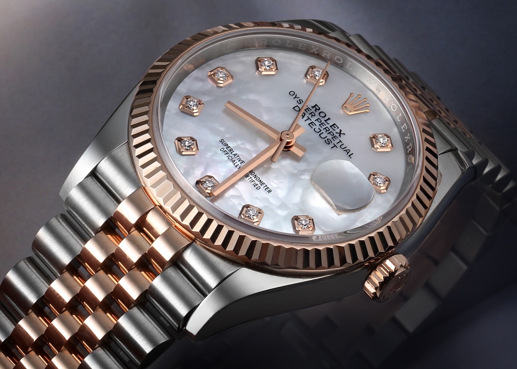 Rolex Datejust 36mm Oystersteel and 18k Everose gold mens watch 126231 with a white mother-of-pearl factory diamond dial, fluted rose gold bezel, and two-tone Jubilee bracelet.