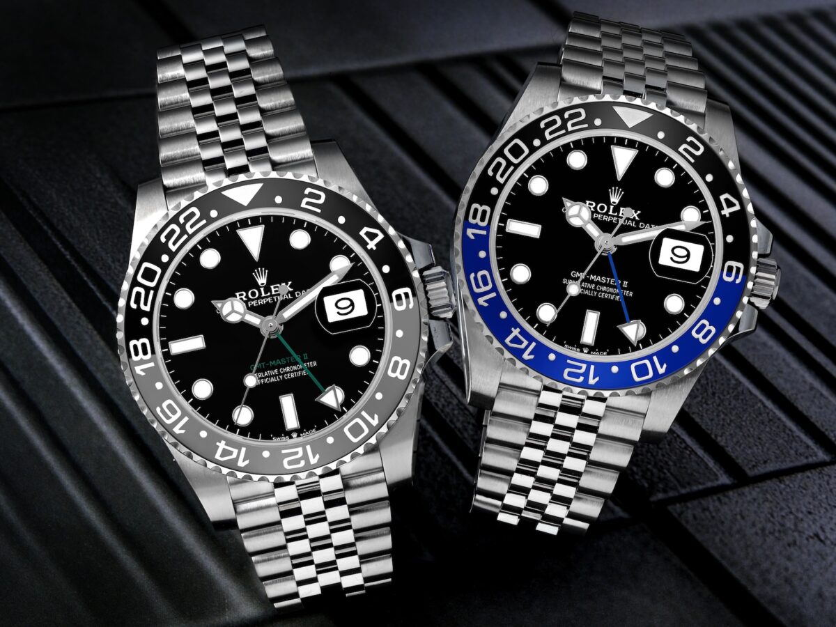 Side-by-side comparison of the Rolex GMT-Master II Bruce Wayne 126710GRNR and Batgirl 126710BLNR on Jubilee bracelets.