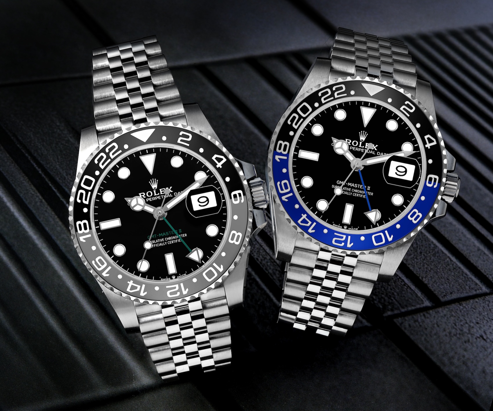 Side-by-side comparison of the Rolex GMT-Master II Bruce Wayne 126710GRNR and Batgirl 126710BLNR on Jubilee bracelets.